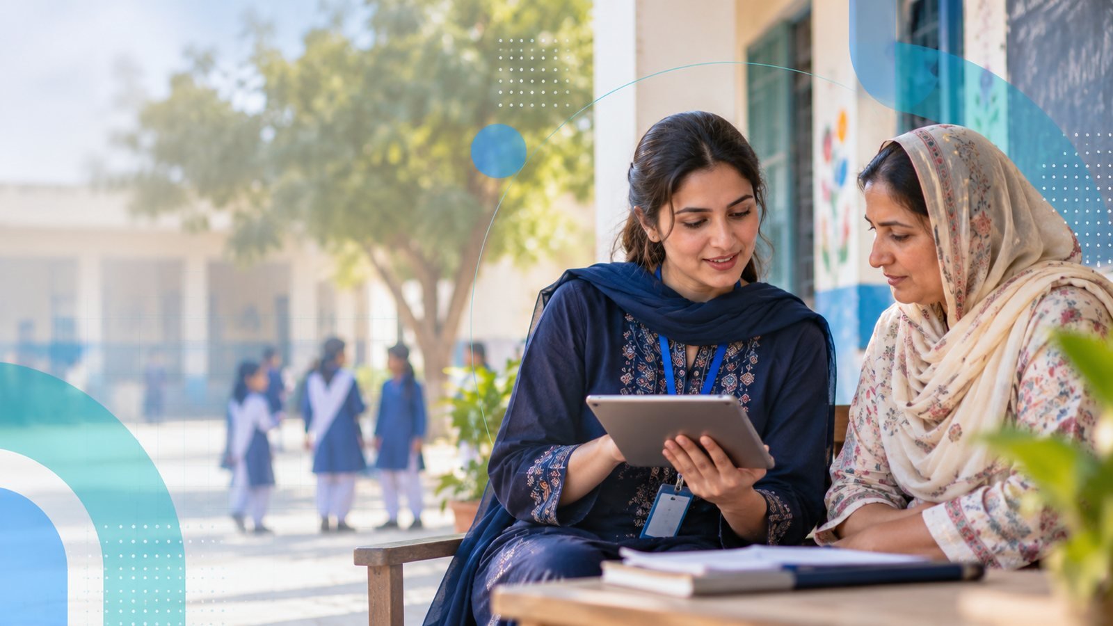 A DIRP researcher discussing school-level findings with a head teacher